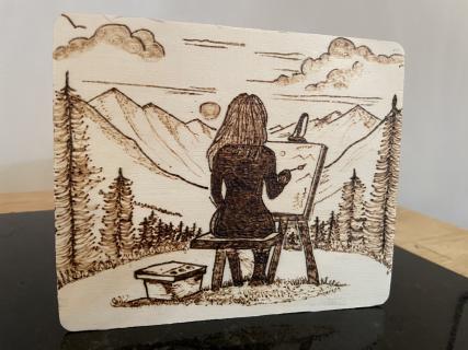 Woman Painting on Hillside